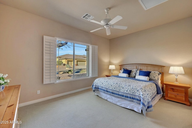 carpeted bedroom with a ceiling fan, visible vents, and baseboards