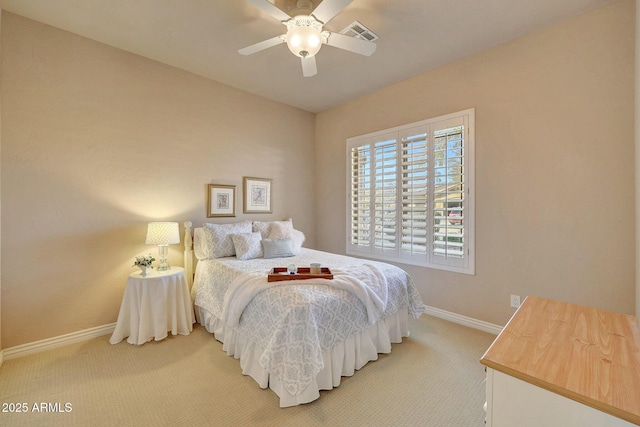 carpeted bedroom with visible vents, ceiling fan, and baseboards