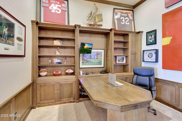 office with a wainscoted wall and crown molding