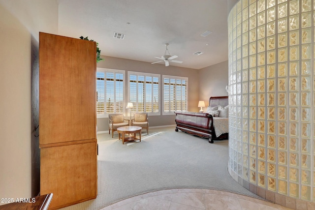 tiled bedroom with carpet floors, baseboards, and visible vents