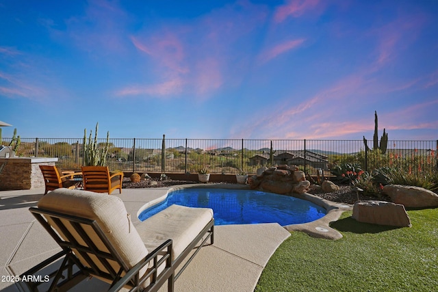 view of pool featuring a patio, a fenced backyard, and a fenced in pool