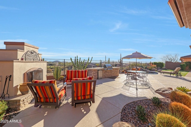 view of patio / terrace with an outdoor living space with a fireplace, outdoor dining area, fence, and a grill