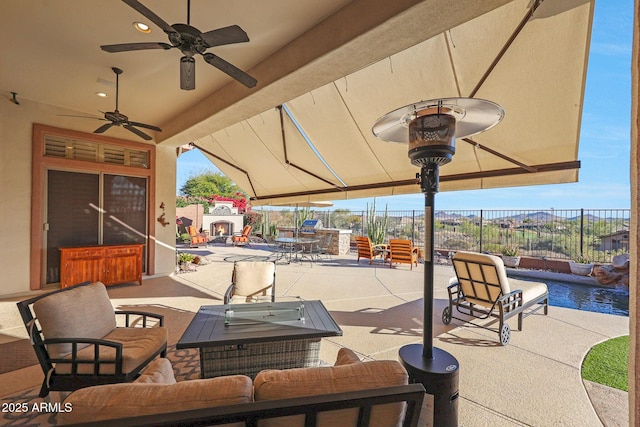 view of patio / terrace with outdoor dining space, outdoor lounge area, fence, and a ceiling fan