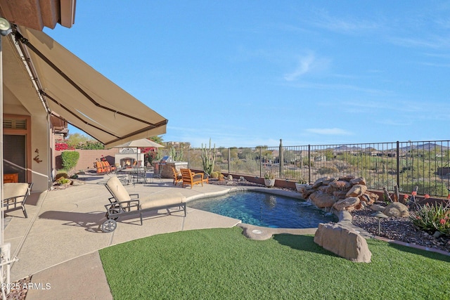 view of pool featuring a patio area and a fenced backyard