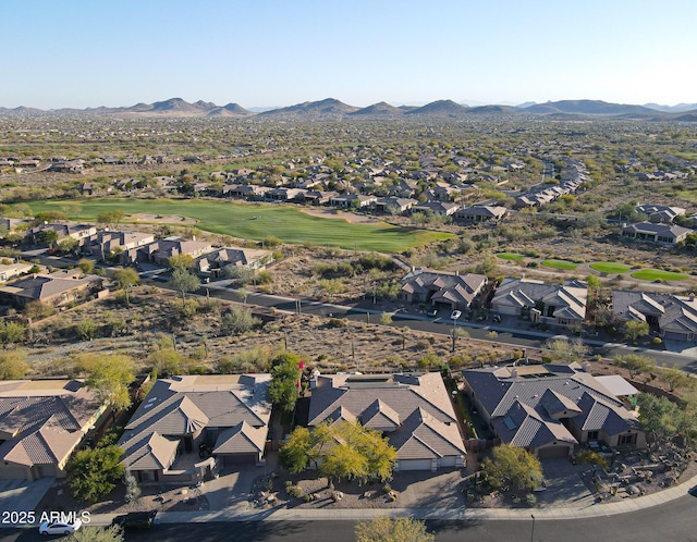 aerial view featuring a mountain view, golf course view, and a residential view