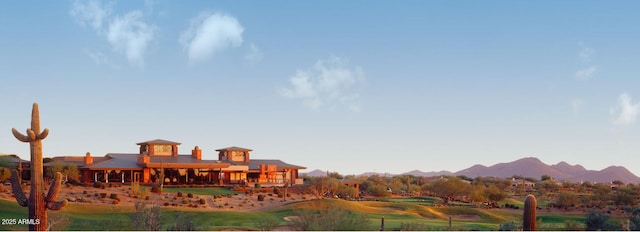 exterior space featuring a mountain view and golf course view