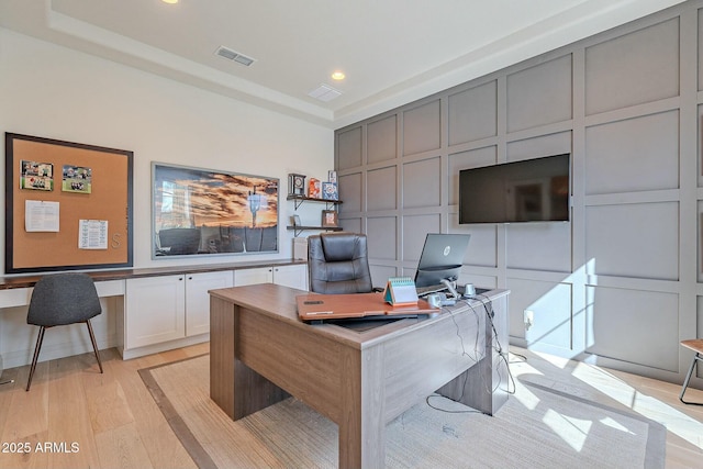 office space with light hardwood / wood-style floors