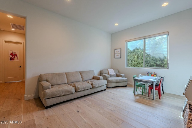 living room with light hardwood / wood-style floors