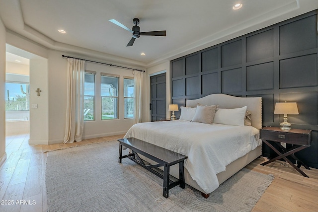 bedroom with ceiling fan and light hardwood / wood-style flooring