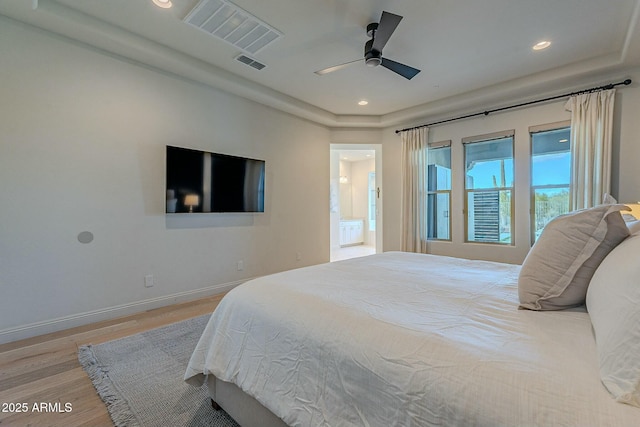 bedroom featuring light hardwood / wood-style flooring and ceiling fan