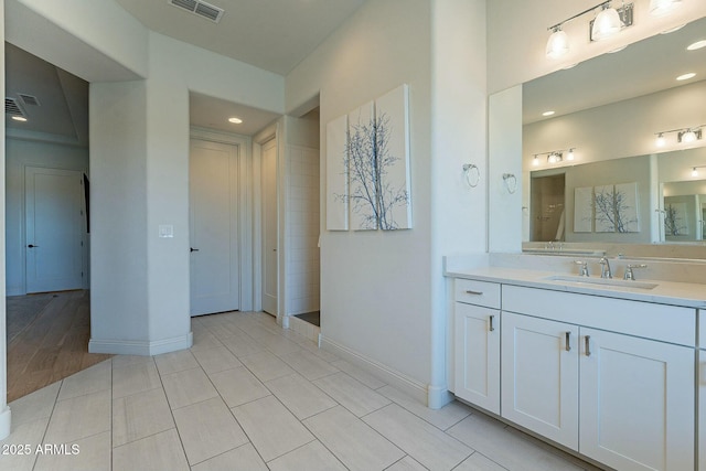 bathroom with tile patterned flooring and vanity