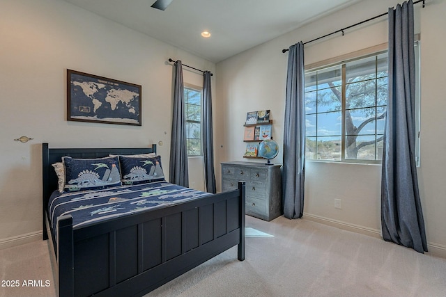 carpeted bedroom with ceiling fan