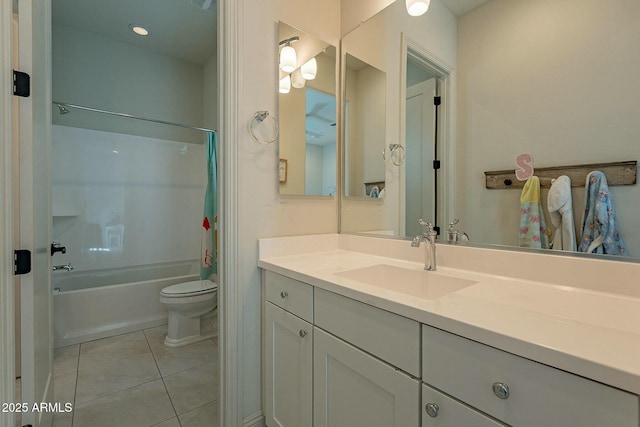 full bathroom featuring shower / bath combo with shower curtain, tile patterned flooring, vanity, and toilet