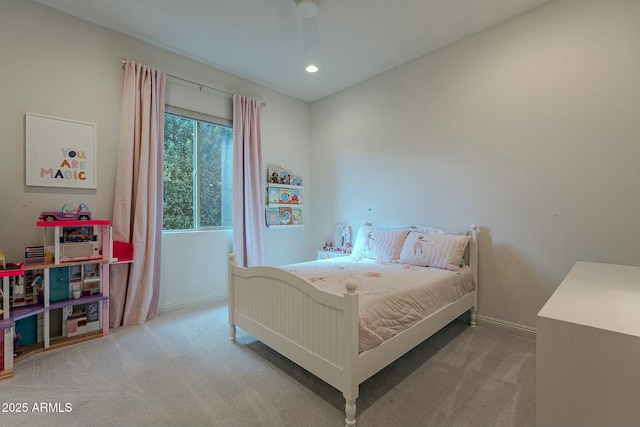 bedroom with ceiling fan and light colored carpet