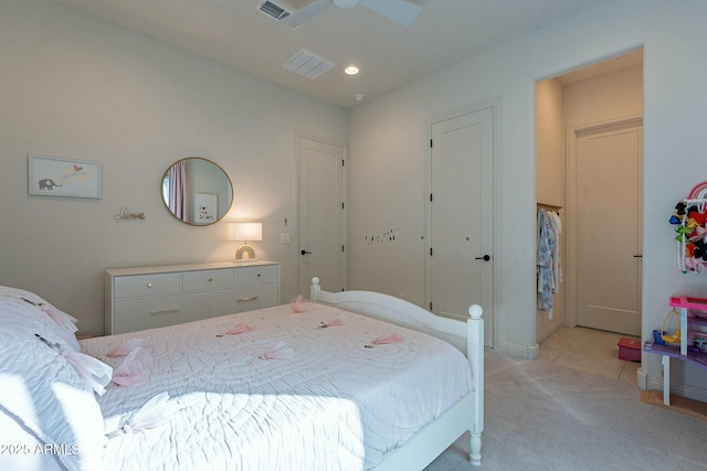 bedroom with ceiling fan and light tile patterned flooring