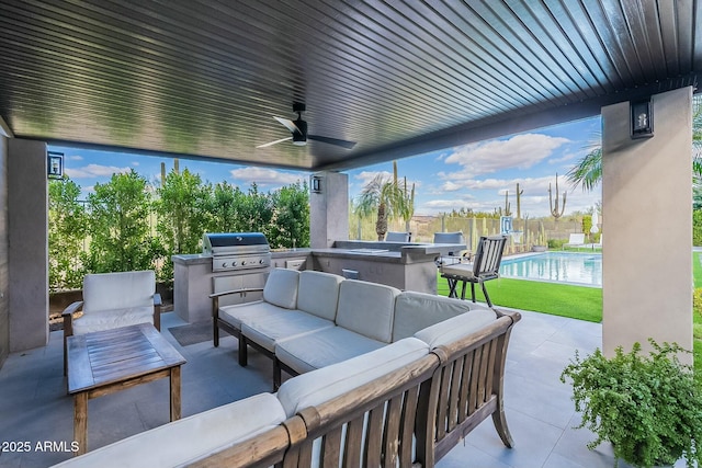 view of patio / terrace with an outdoor kitchen, area for grilling, an outdoor hangout area, and ceiling fan