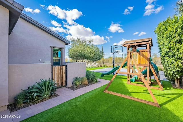 view of playground with a yard