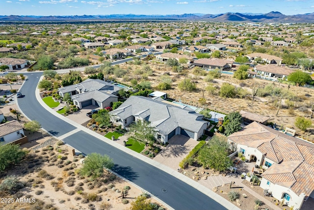 birds eye view of property featuring a mountain view