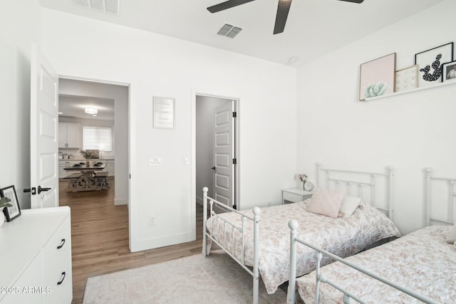 bedroom featuring ceiling fan and light hardwood / wood-style floors