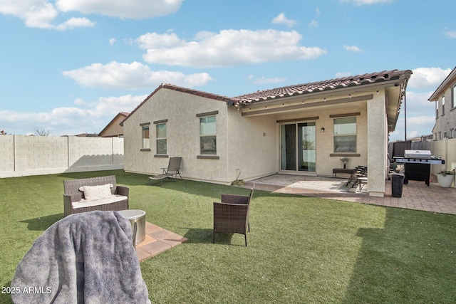 rear view of house with an outdoor living space, a yard, and a patio area