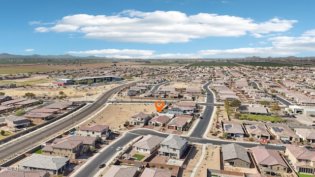 birds eye view of property with a mountain view