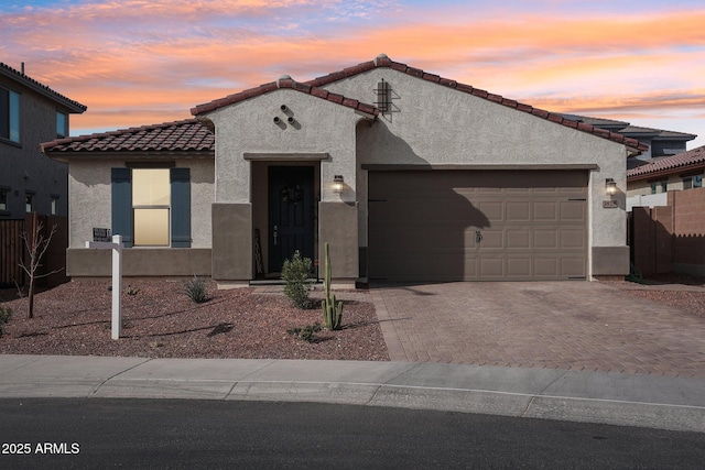 view of front of property with a garage