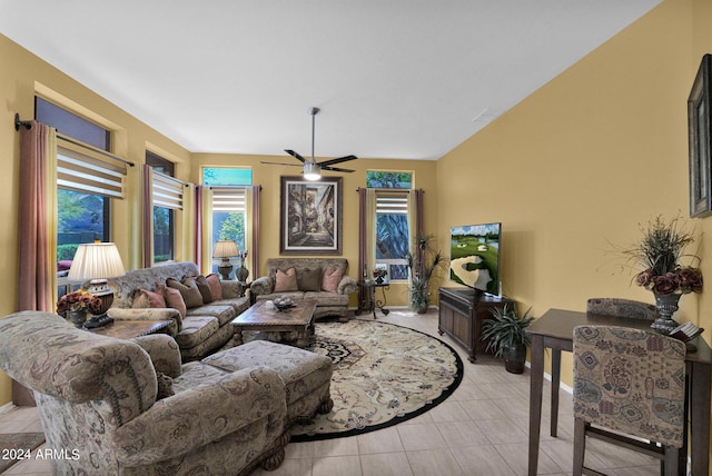 tiled living room with ceiling fan