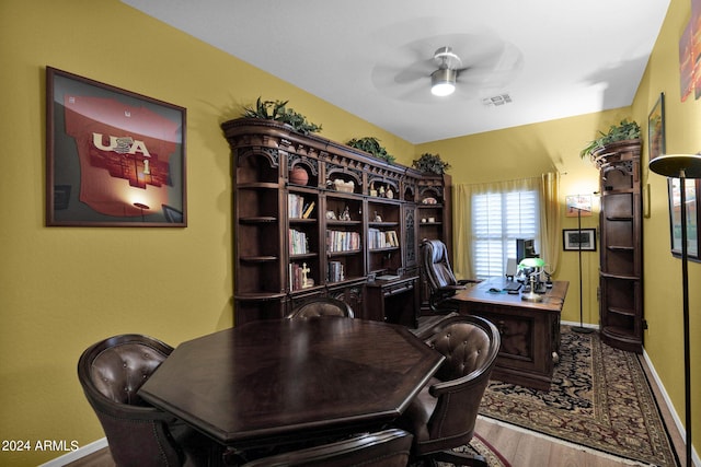 office with wood-type flooring and ceiling fan