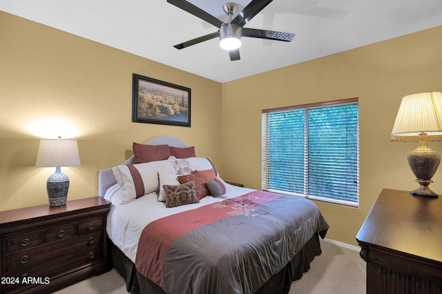 bedroom featuring light colored carpet and ceiling fan