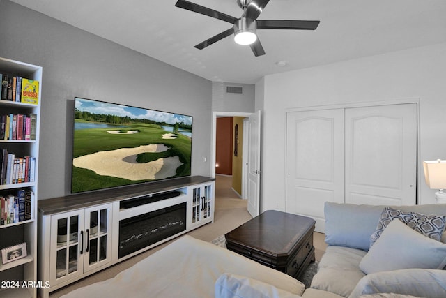 carpeted living room featuring ceiling fan