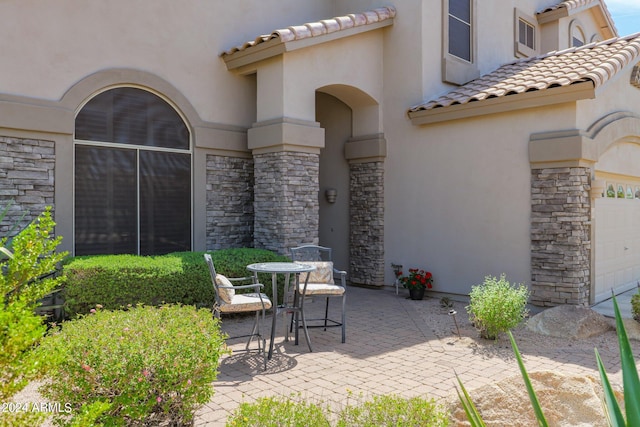 view of patio / terrace featuring a garage