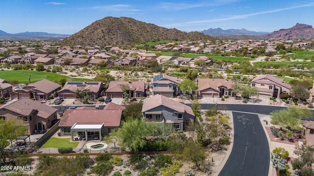 birds eye view of property featuring a mountain view