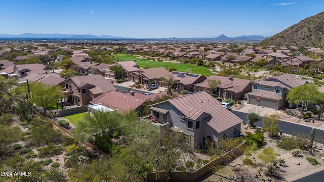 birds eye view of property with a mountain view