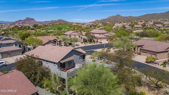 birds eye view of property with a mountain view