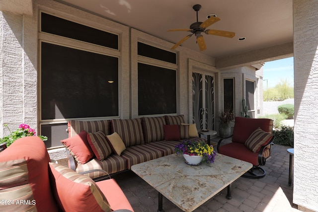 view of patio / terrace featuring ceiling fan and an outdoor living space