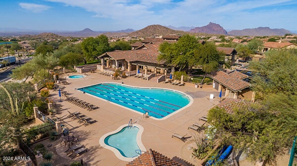 view of pool featuring a patio and a mountain view