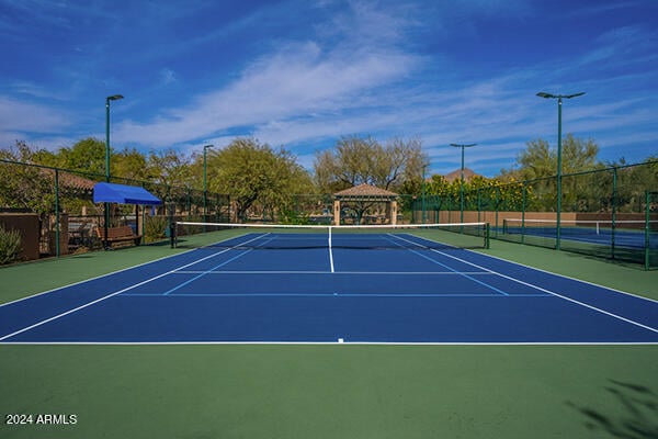 view of sport court featuring basketball hoop