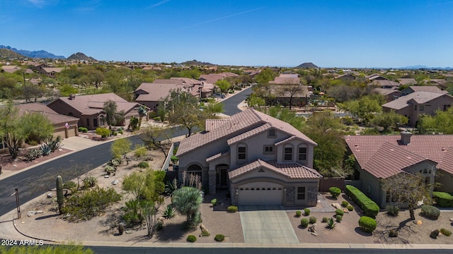 birds eye view of property featuring a mountain view