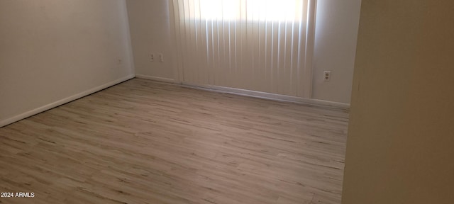 unfurnished room featuring light wood-type flooring