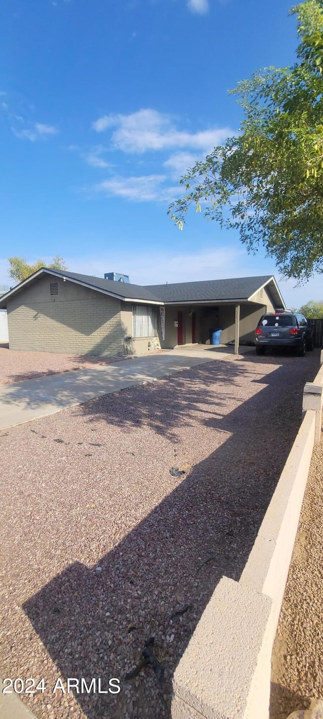 view of front of house featuring a carport