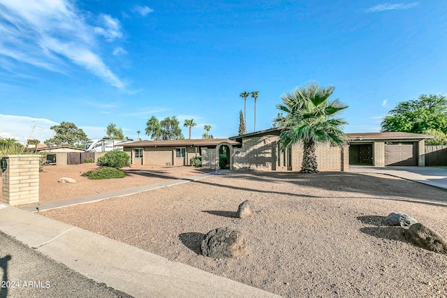 ranch-style house featuring a garage