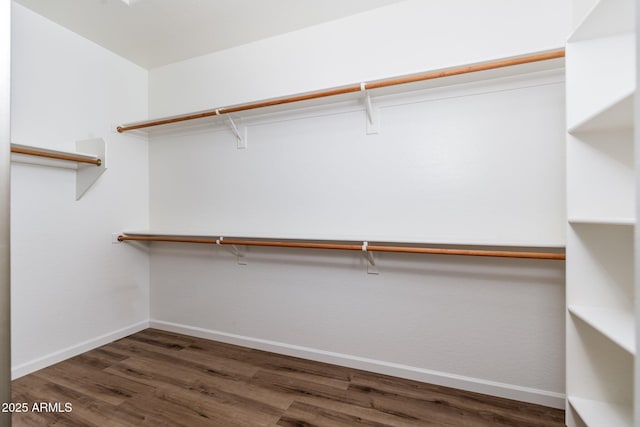 spacious closet with wood finished floors