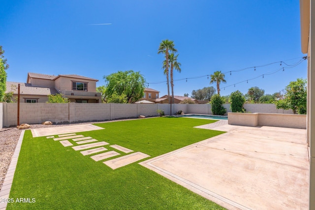 view of yard featuring a patio and a fenced backyard