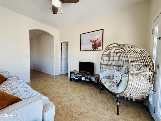 719 S 2nd St, Avondale, AZ 85323 - tiled living area featuring arched walkways, a ceiling fan, and baseboards