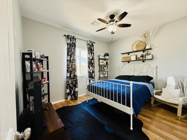 719 S 2nd St, Avondale, AZ 85323 - bedroom with wood finished floors, ceiling fan, and baseboards