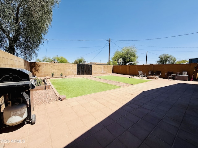 719 S 2nd St, Avondale, AZ 85323 - fenced backyard featuring a patio and a grill