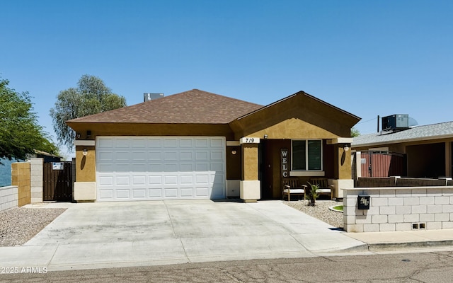 719 S 2nd St, Avondale, AZ 85323 - ranch-style home with a garage, concrete driveway, central AC, a gate, and stucco siding