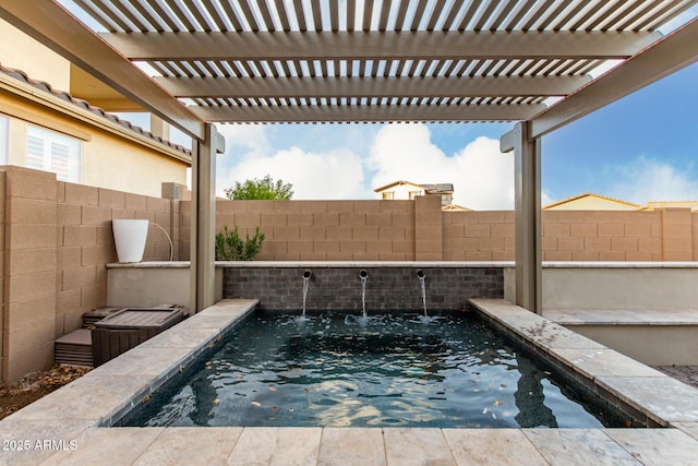 view of pool with a fenced backyard