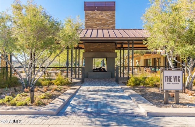 view of property's community with decorative driveway