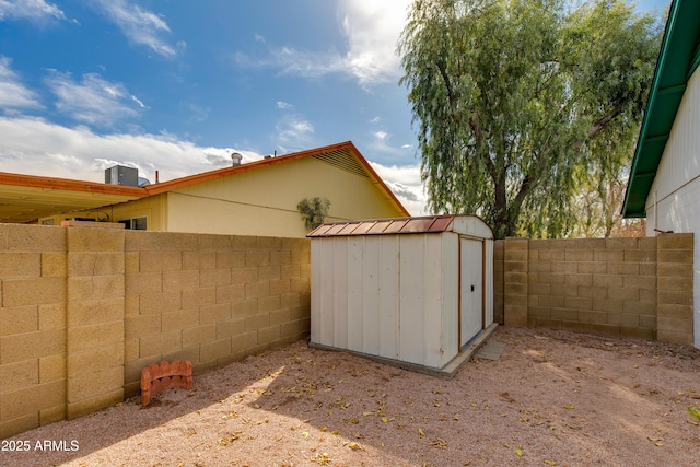 view of shed with a fenced backyard